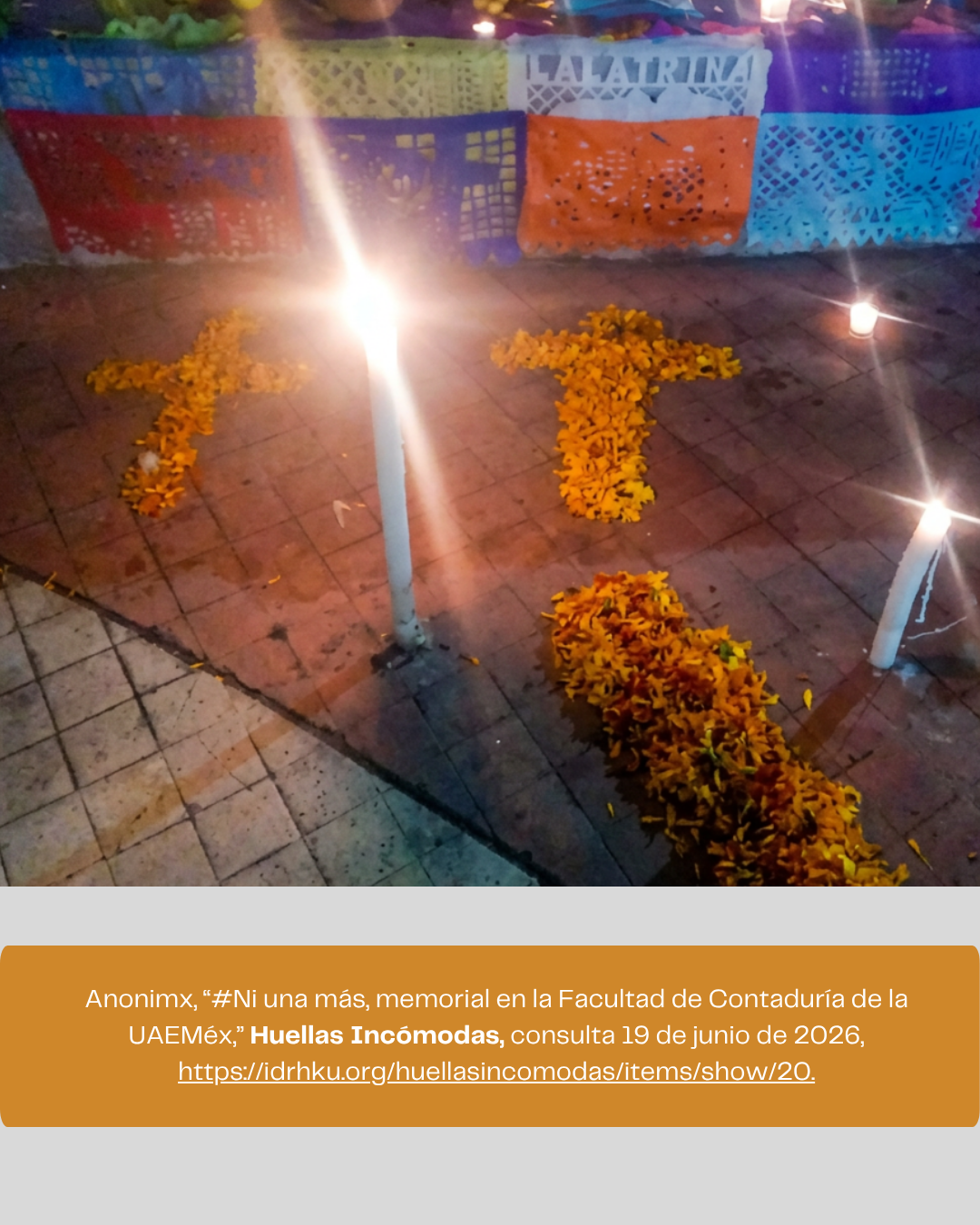 Memorial installation on a university campus featuring candles and marigold flowers arranged in symbolic shapes to honor a murdered professor and victims of gender-based violence.