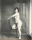 Bellocq, E. J. Storyville Photo, Woman kneeling on chair. 1912.