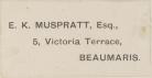 Cream-coloured adhesive label with dark grey writing that reads: E. K. Muspratt, Esq., 5, Victoria Terrace, Beaumaris.