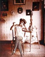 Bellocq, E. J. Photograph of Woman in Striped Leggings. 1915.