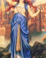 A woman standing in front of a luxurious city holding her hair around her. She is wearing a blue dress and is barefoot, standing on flowers and rocks.
