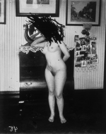 Bellocq, E. J. Storyville Photo, Woman standing, deliberated damaged. 1912.