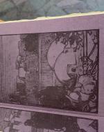 Purple paper with a village scene stamped onto it. 