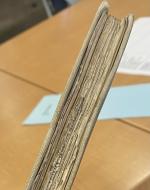 Worn/torn edges of book pages