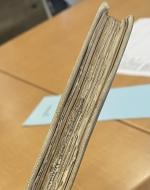 Worn/torn edges of book pages