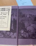 Cover pages depicting a scene of a city done in black ink on purple paper