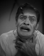 Dr. Jekyll grasping at his throat as he transforms into Mr. Hyde. 