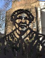 A cut-out bust of Mary Seacole is pictured in front of a brick building.