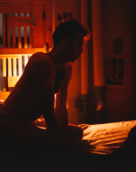 Goldin, Nan. Brian on My Bed with Bars, New York City. The Museum of Contemporary Art. 1983.