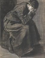 Woman Sitting Alone in Corner with her Hands on Her Face