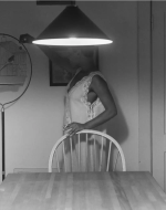 Weems, Carrie Mae. Untitled (Woman Feeding Bird) from The Kitchen Table Series. 1990. 