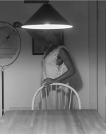 Weems, Carrie Mae. Untitled (Woman Feeding Bird) from The Kitchen Table Series. 1990. 