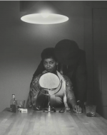 Weems, Carrie Mae. Untitled (Man and Mirror) from The Kitchen Table Series. 1990. 