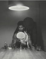Weems, Carrie Mae. Untitled (Man and Mirror) from The Kitchen Table Series. 1990. 