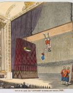 Circus preformer standing upside down on the cieling infront of audience