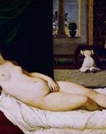 Woman lays upon bed starting a viewer.