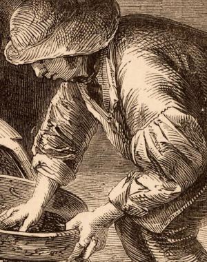 A man sifts through a bucket in a London sewer