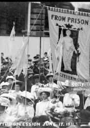 Newspaper photo showing "From Prison to Citizenship" banner in Coronation Procession