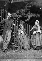 Black-and-white photograph of Victorian family in a garden