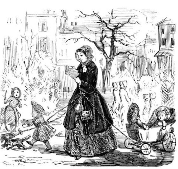 A mother walks in the park with her children clipped to her chatelaine.