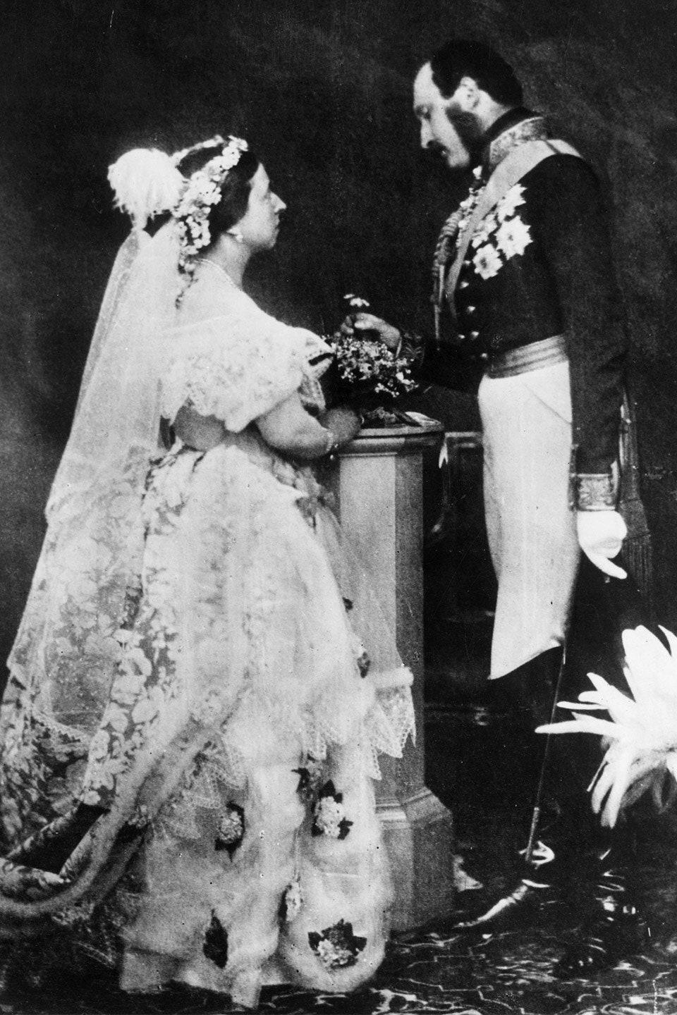 Black and White photograph of Albert and Victoria. Victoria is covered in lace from head to toe. Albert is wearing formal military dress.