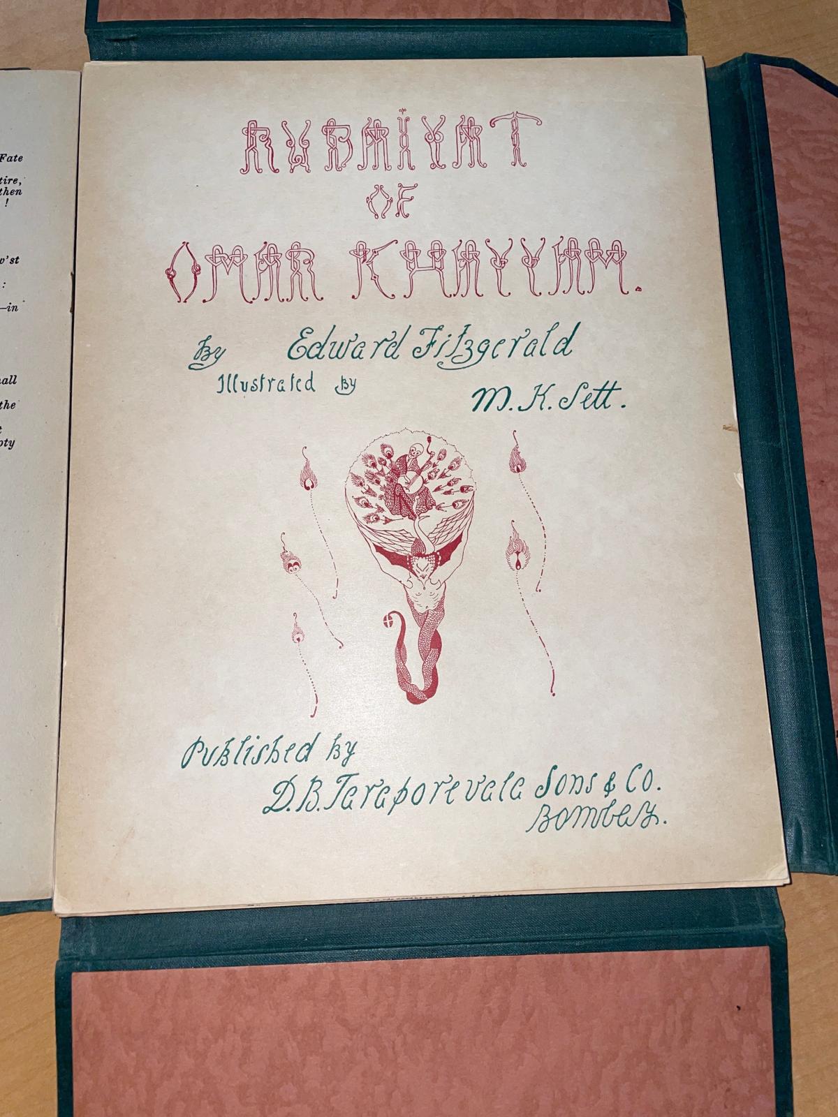 cover of the Rubáiyát of Omar Khayyám in the dark green and gilt gold cloth with the Art Deco typeface , 59 loose pages inside the unbound edition of the book, one of the many illustrations that "shocked" some readers due to the nudity and , 