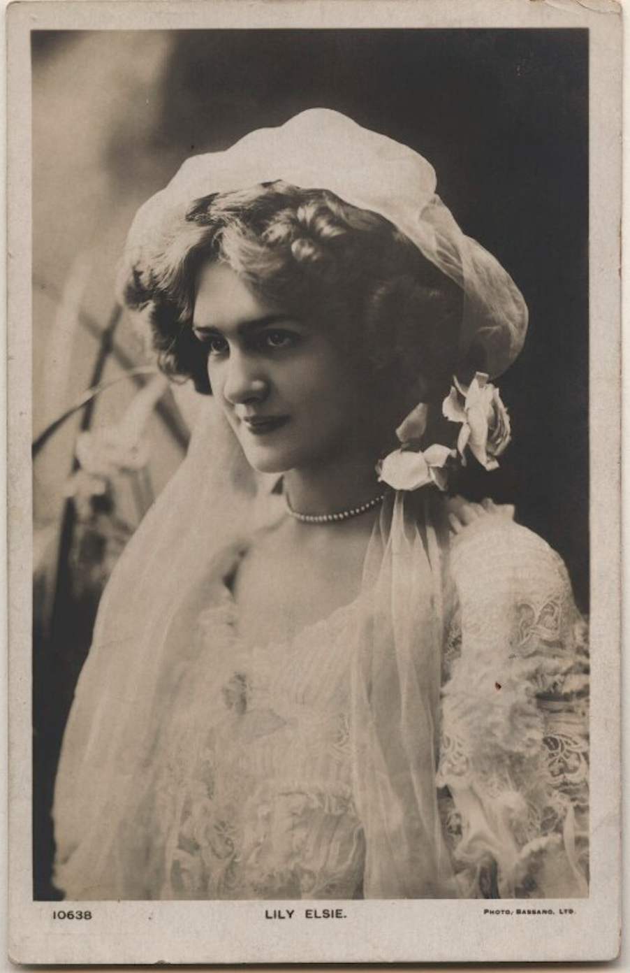 A photograph of Lily Elsie, posing for a black and white portrait. 